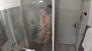 A couple gets intimate in the shower, with passionate and intense action
