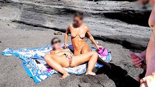 Nude beauty rubs her tits and cunts on the beach while jerking off a guy