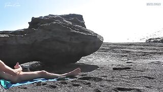 Nude beauty rubs her tits and cunts on the beach while jerking off a guy