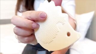 A Japanese woman masturbates with her huge boobs, showcasing a remarkable technique
