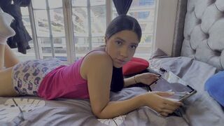 A girl playing a game with her face in the pillow can’t control herself