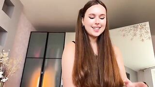 A sexy brunette in a red room gets wild and messy with her tongue