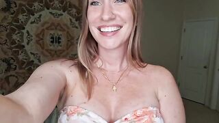 A girl is giving a sensual breast massage with shimmering oil