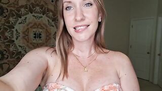 A girl is giving a sensual breast massage with shimmering oil