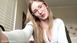 The white lines on her lips - the best lipstick. A girl with glasses wearing a black long-sleeved dress, lying on the bed, playing with her tongue between her lips and applying white lipstick. This is Emma Ruby, known for her nerdy charm and captivating P