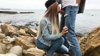A hot blonde girl skillfully fucks with her mouth outdoors